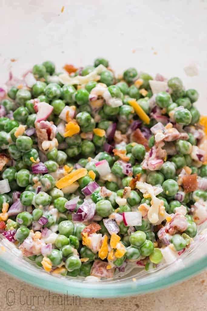 making pea salad in salad bowl