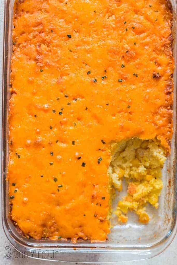 cheesy sweet corn casserole in casserole dish