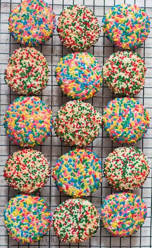 baked rainbow sprinkle sugar cookies cooling on wire rack