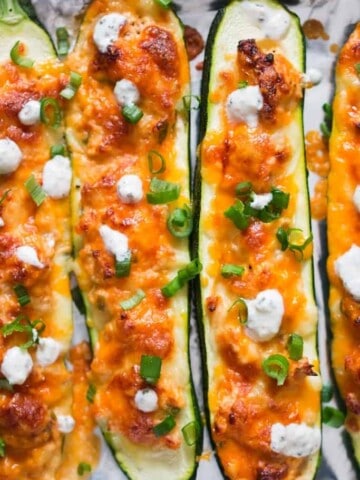 healthy zucchini boats with buffalo chicken stuffing and ranch dressing