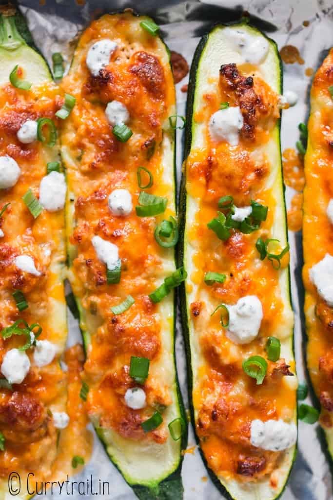 healthy zucchini boats with buffalo chicken stuffing and ranch dressing