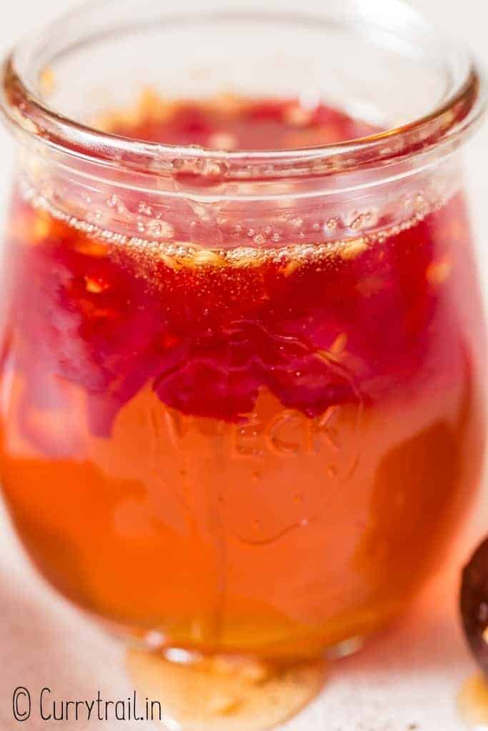 close up view of honey infused with hot peppers