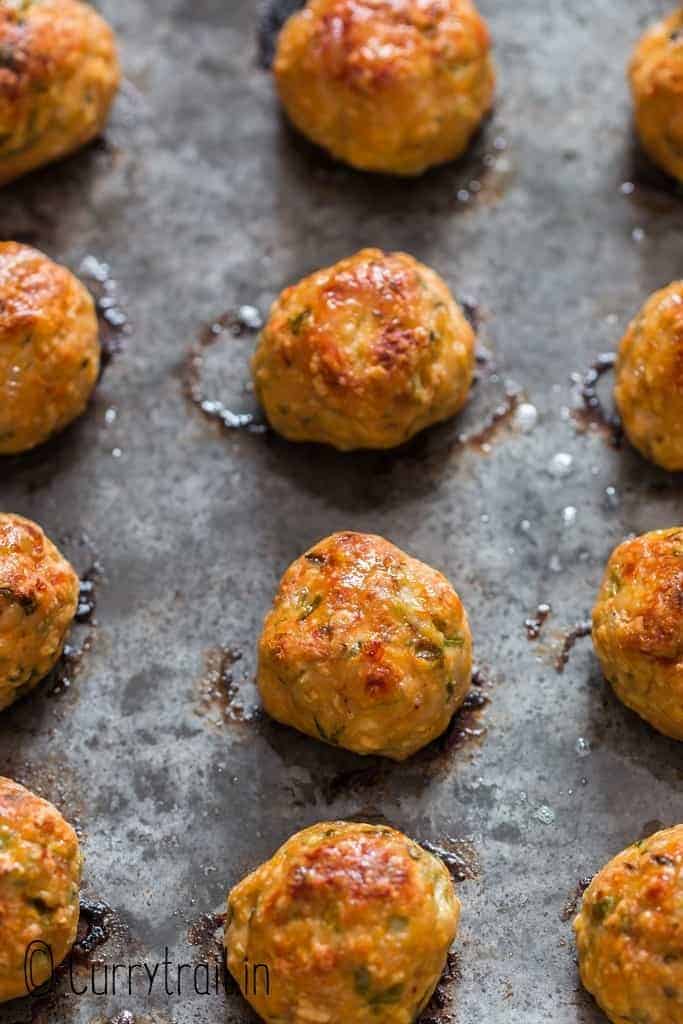 baked chicken meatballs on baking tray