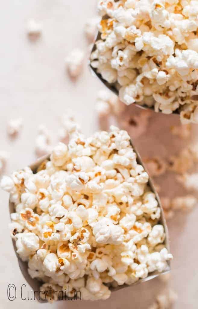 close up view of movie style popcorn served in popcorn tubs