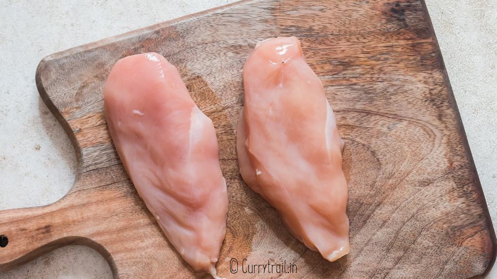 chicken breasts on cutting board