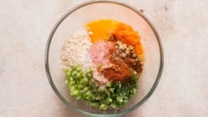 all ingredients for buffalo chicken meatballs in bowl