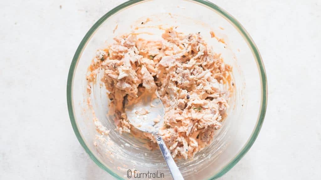 shredded chicken with buffalo cream sauce in bowl