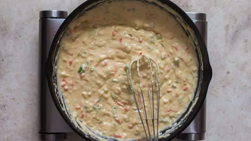 whisk cheese together in a cast iron skillet.