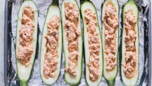 stuffing zucchini boats with buffalo cream cheese chicken