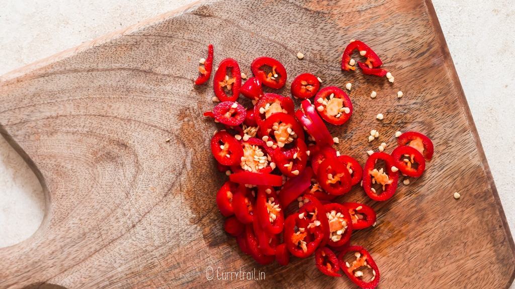 chopping fresno chilies to make hot honey recipe