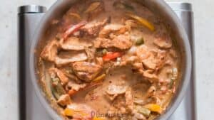 chicken and vegetables on cream sauce to make cajun chicken pasta recipe