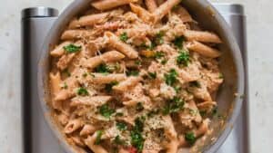 cajun chicken pasta garnished with parmesan cheese and parsley