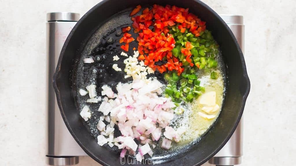 add veggies to cast iron pan