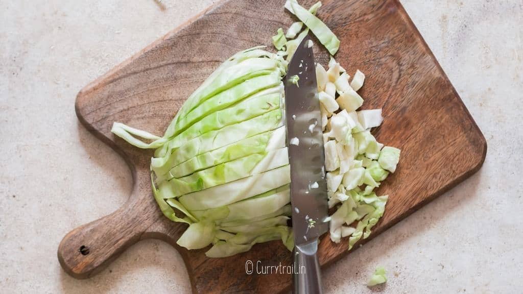 chopping cabbage into bite size pieces