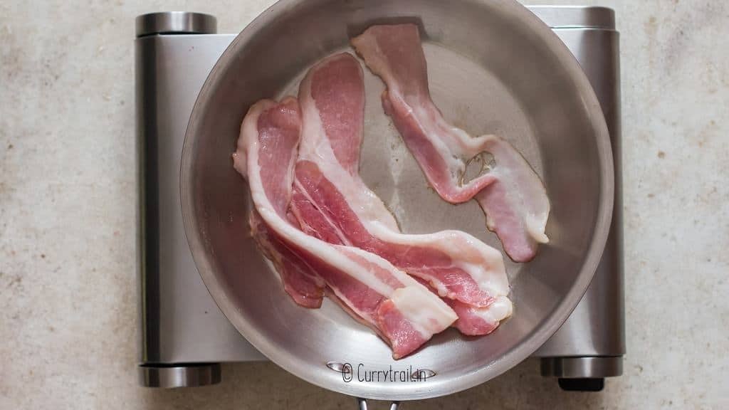 frying bacon until crispy in skillet