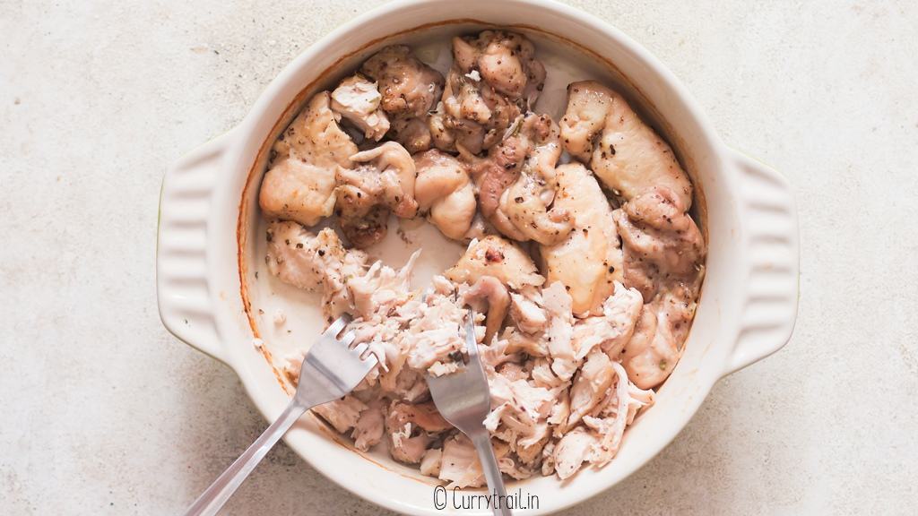 shredding chicken with fork