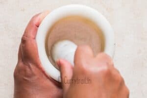 grinding salt in mortal pestle to make movie style popcorn