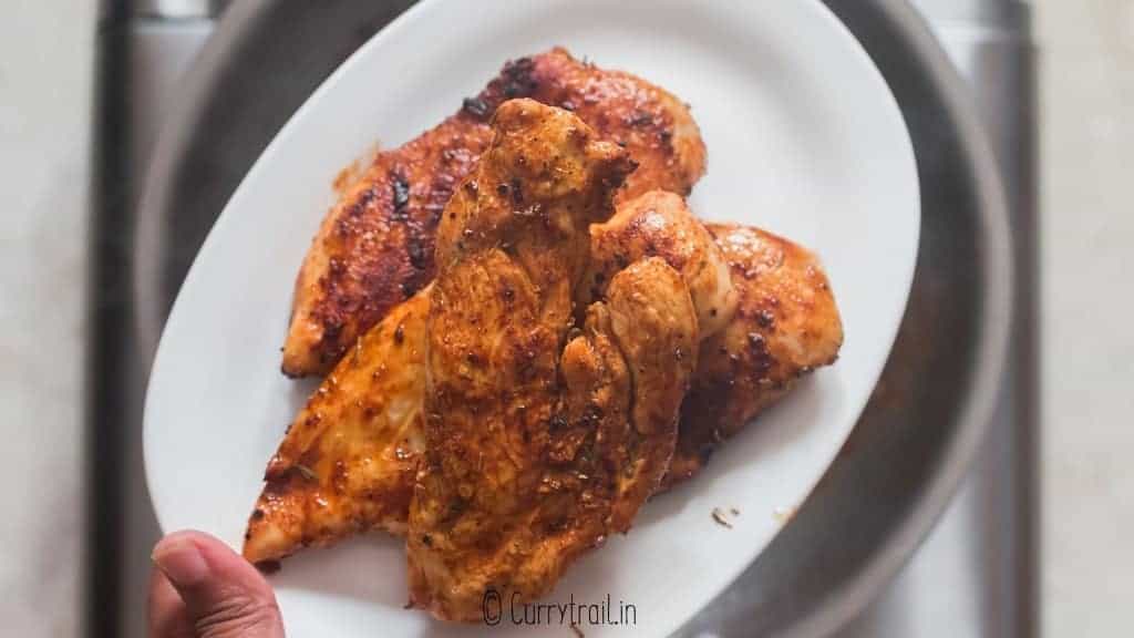 cooked cajun chicken removed onto a plate