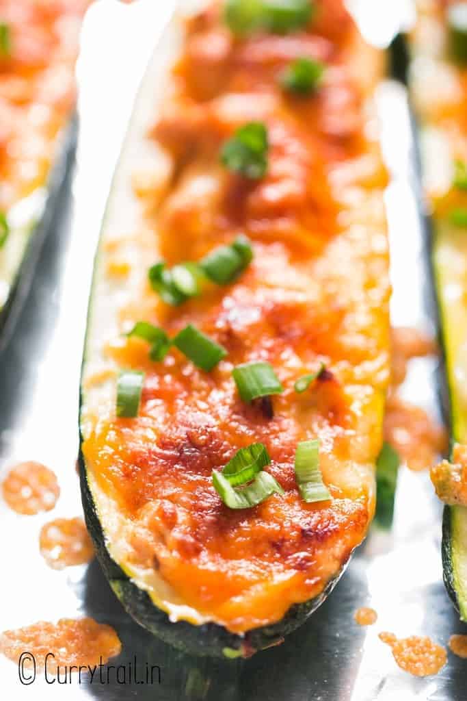 close up view of stuffed zucchini boats