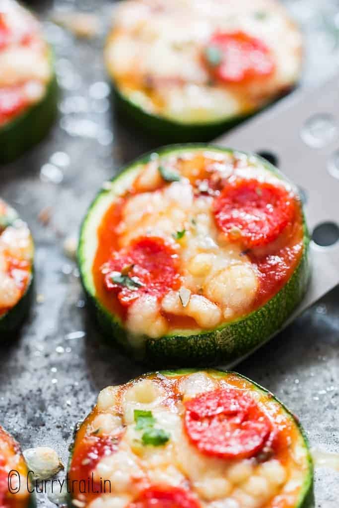 pizza bites with zucchini crust on baking tray