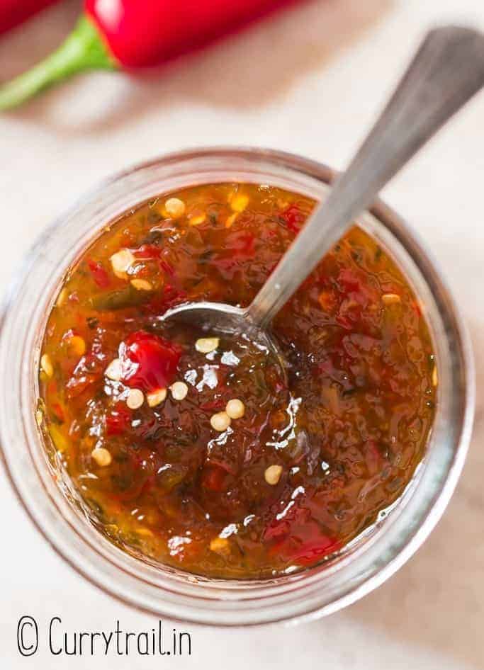 close up view of hot pepper jelly in glass jar