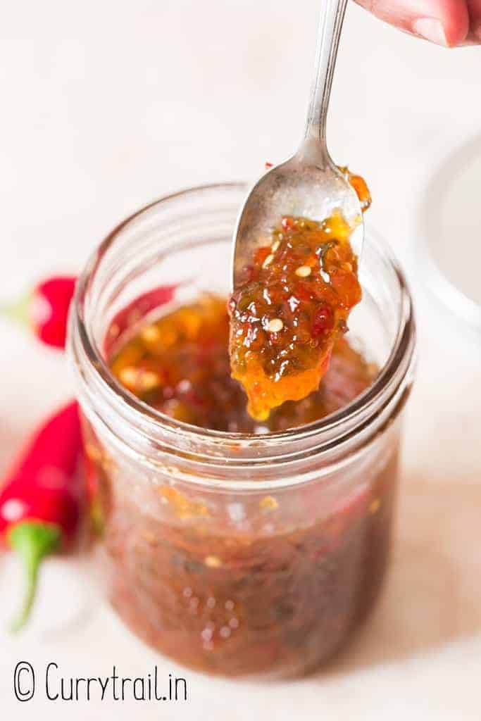 spoonful of jalapeno jelly in glass jar