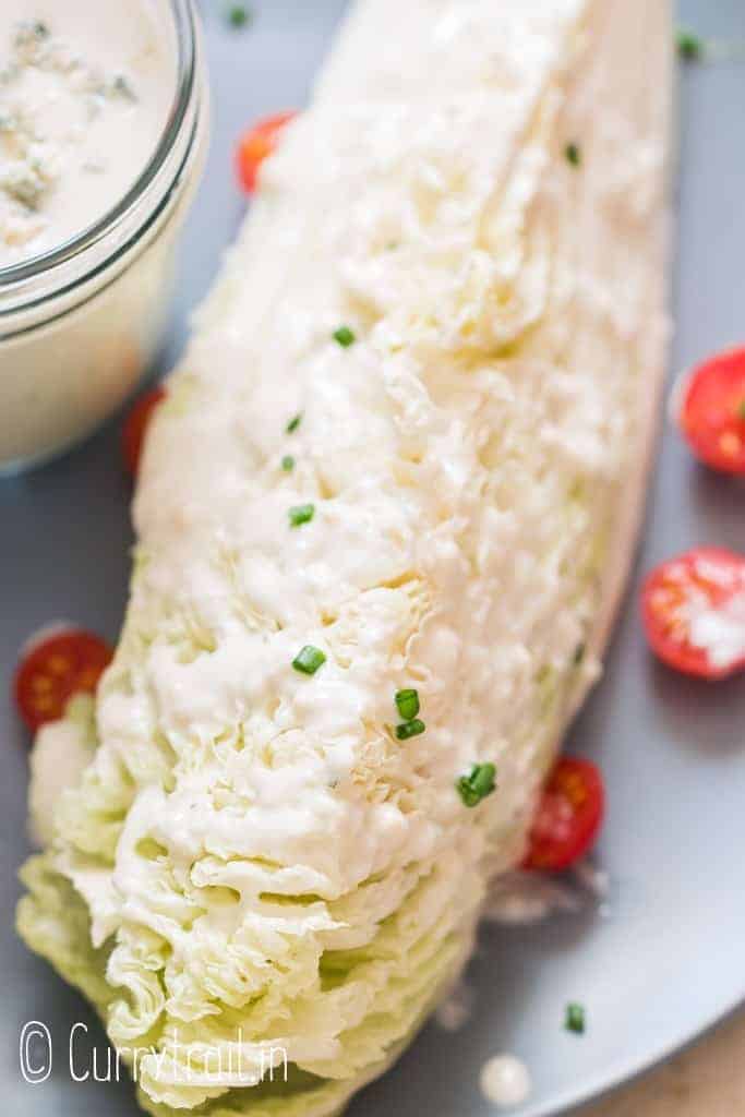 blue cheese salad dressing on lettuce salad 