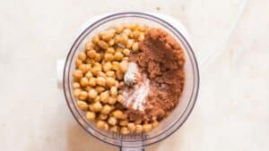 all ingredients for brownie batter hummus in food processor