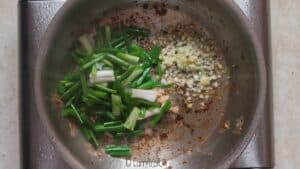 scallions, ginger, garlic in skillet