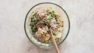 mixing all ingredients for baked chicken meatballs