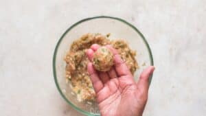 shaping meatballs to make baked chicken meatballs