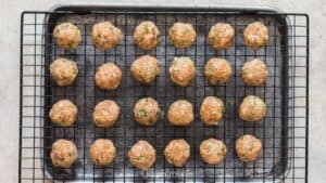 meatballs ready to go into the oven to make baked chicken meatballs