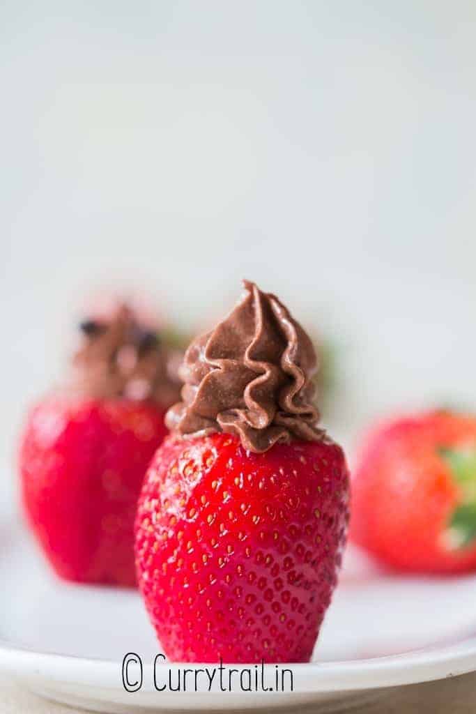 chocolate cheesecake stuffed strawberries on plate