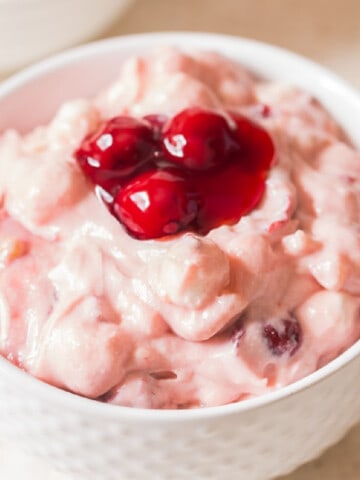 close up cherry salad in ceramic bowl