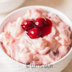 cherry fluff salad in ceramic bowl