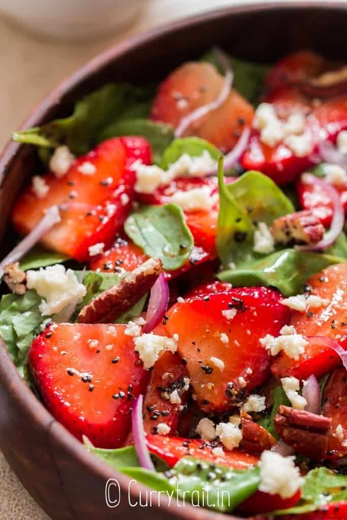 close up of strawberry spinach salad