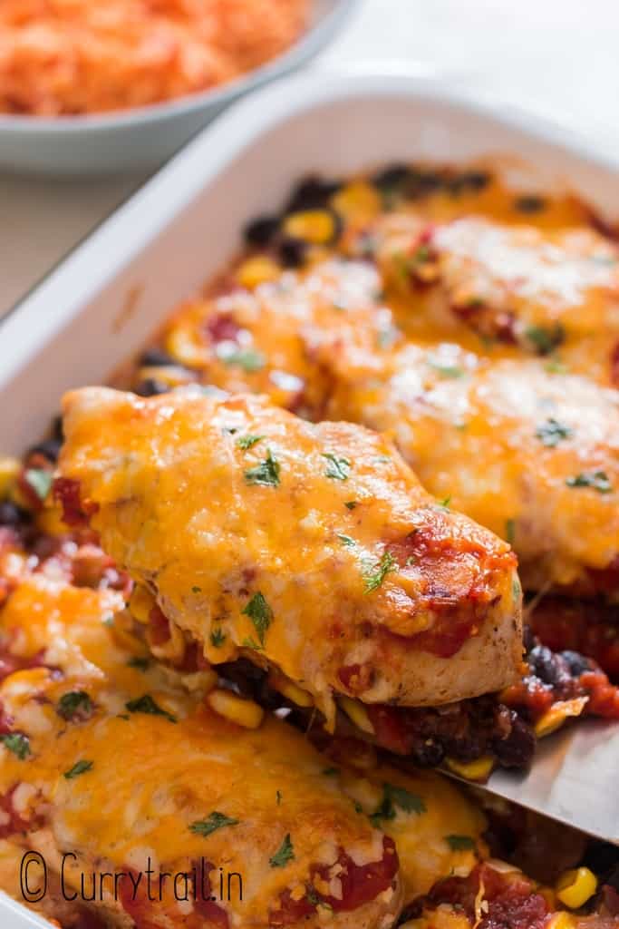 cheesy salsa chicken baked in casserole dish