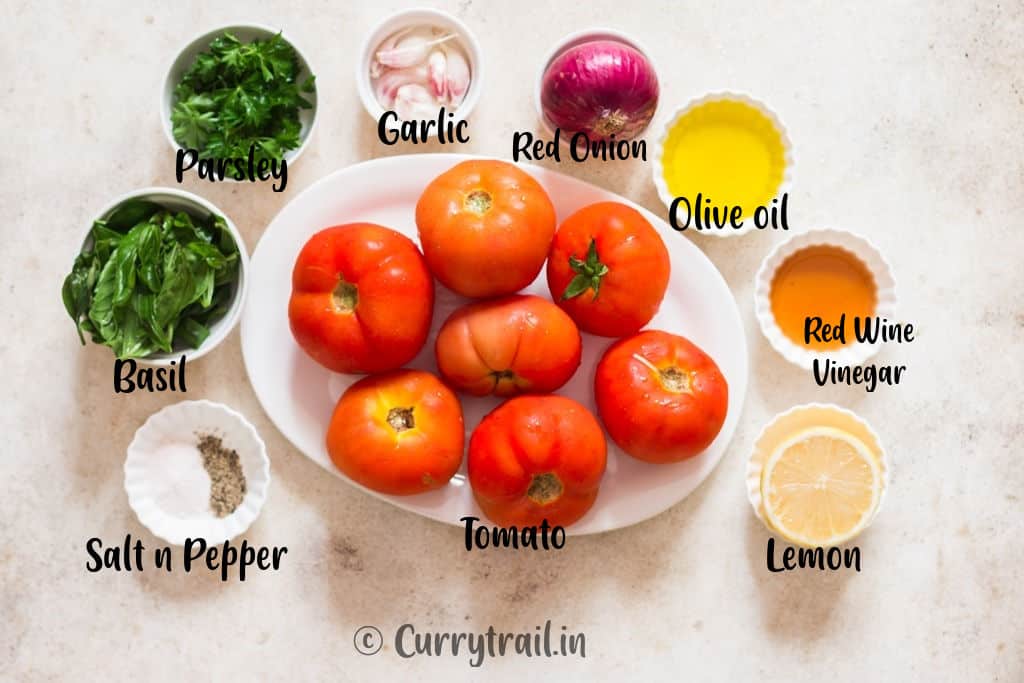 all ingredients for marinated tomatoes on white board