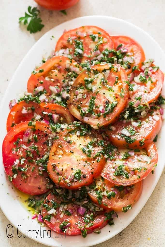 marinated tomatoes salad on white plate