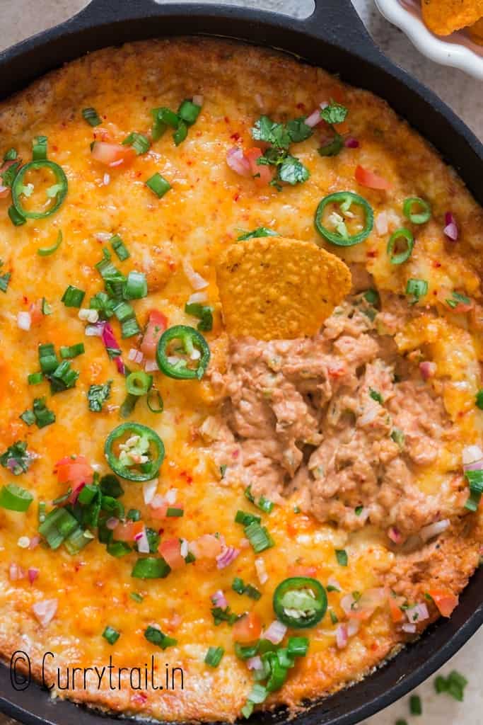 healthy cheesy bean dip in cast iron skillet