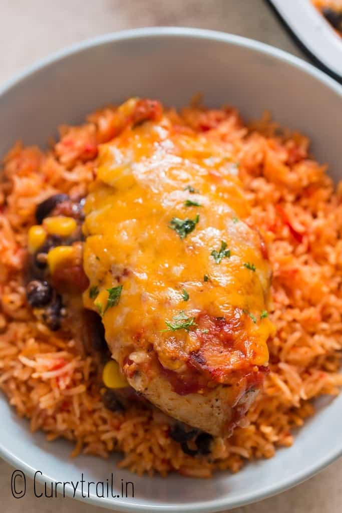 cheesy salsa chicken served with Mexican rice