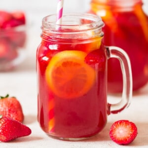 southern sweet tea with strawberries in 2 jars