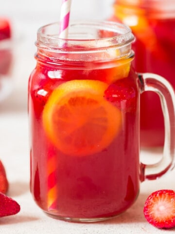 southern sweet tea with strawberries in 2 jars