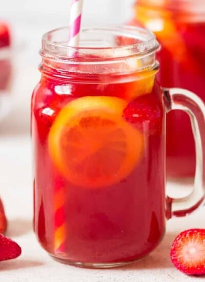 southern sweet tea with strawberries in 2 jars