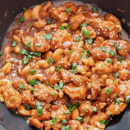 saucy cashew chicken cooked in a wok
