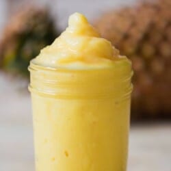 frozen dole whip made of frozen pineapple in a glass jar.