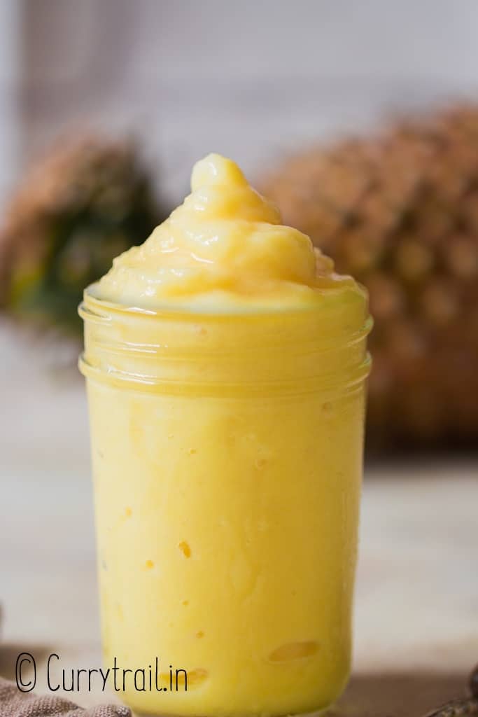 frozen dole whip made of frozen pineapple in a glass jar.