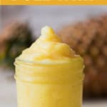 frosty dole whip made of pineapples in a glass jar with text.