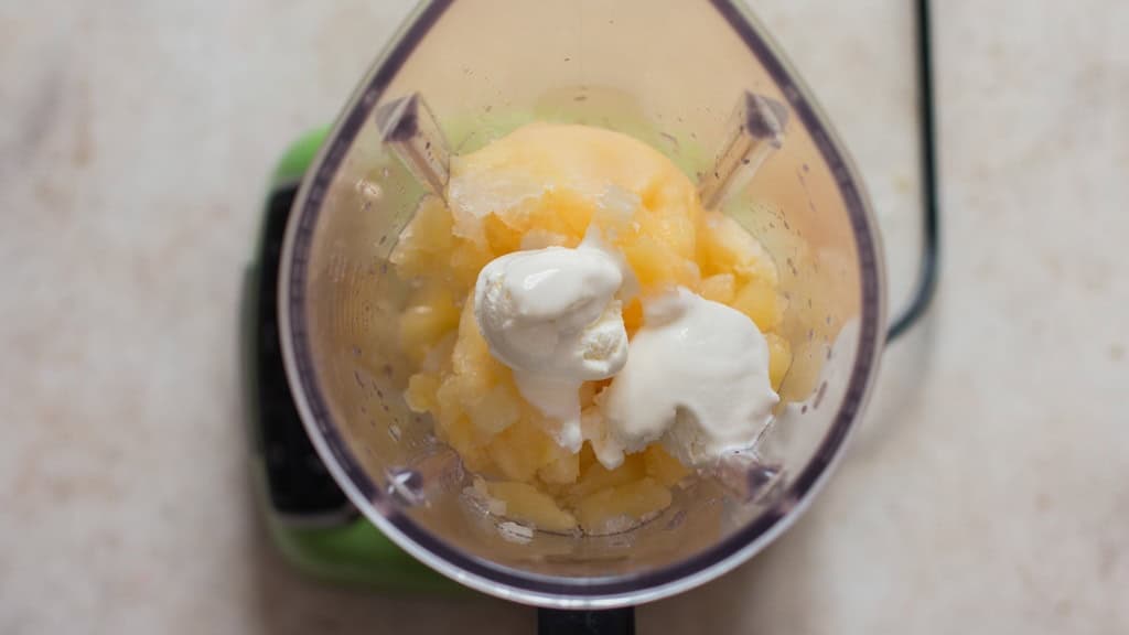 making pineapple dole whip in a blender.