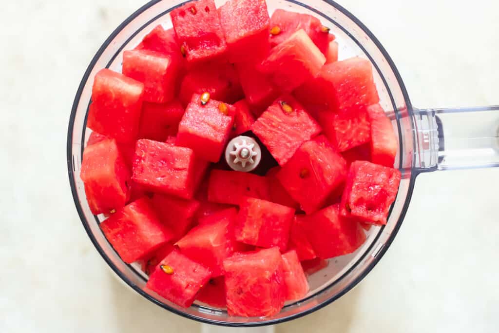 cut watermelon cubes juiced in a food processor.